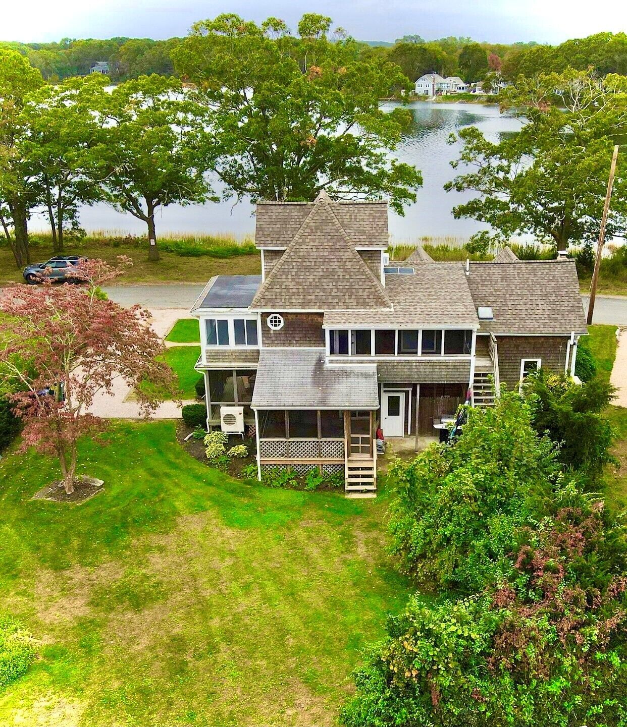 Aerial view of the North Kingstown cape, the lawn, and the water.